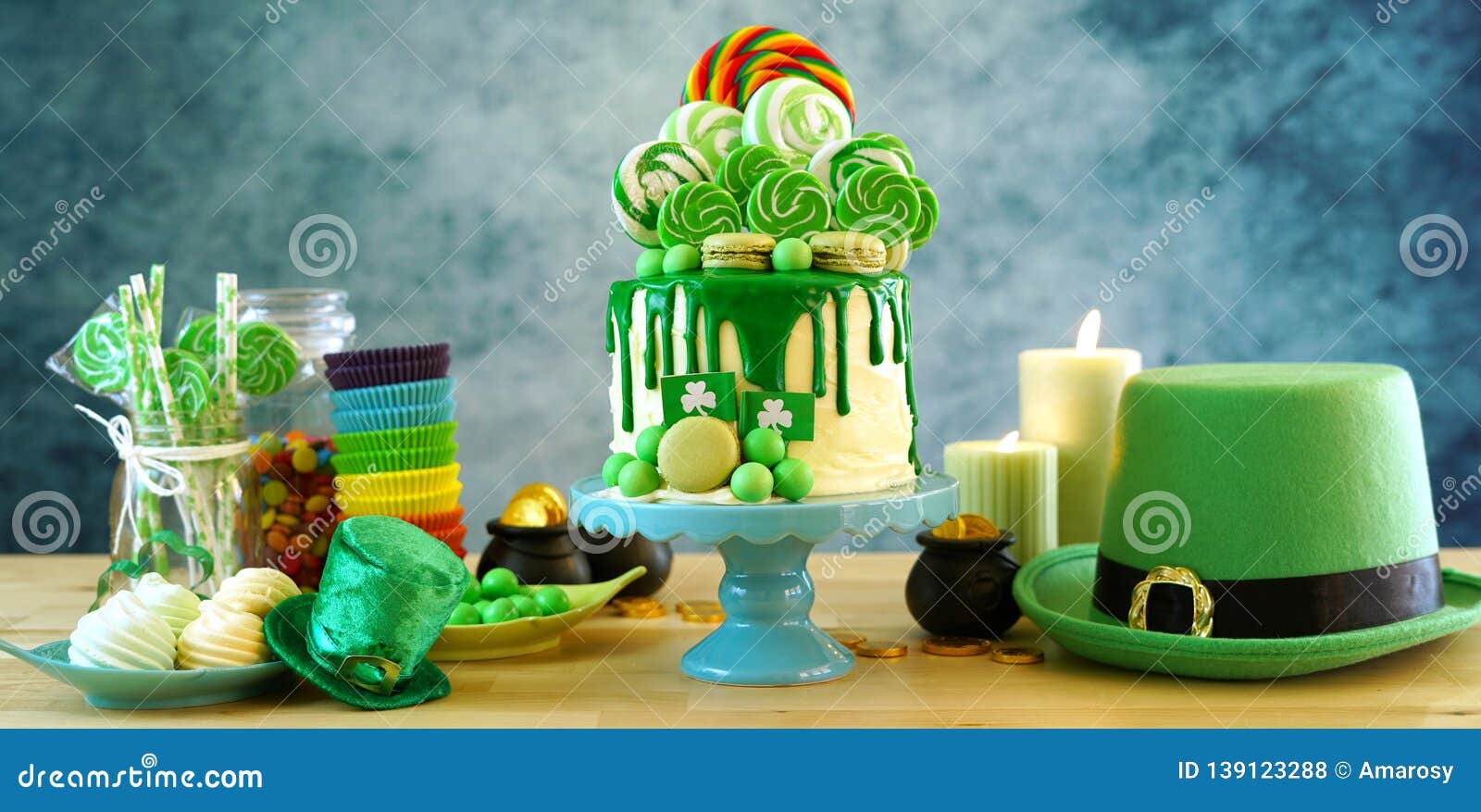 st patrick`s day candyland drip cake and party table.