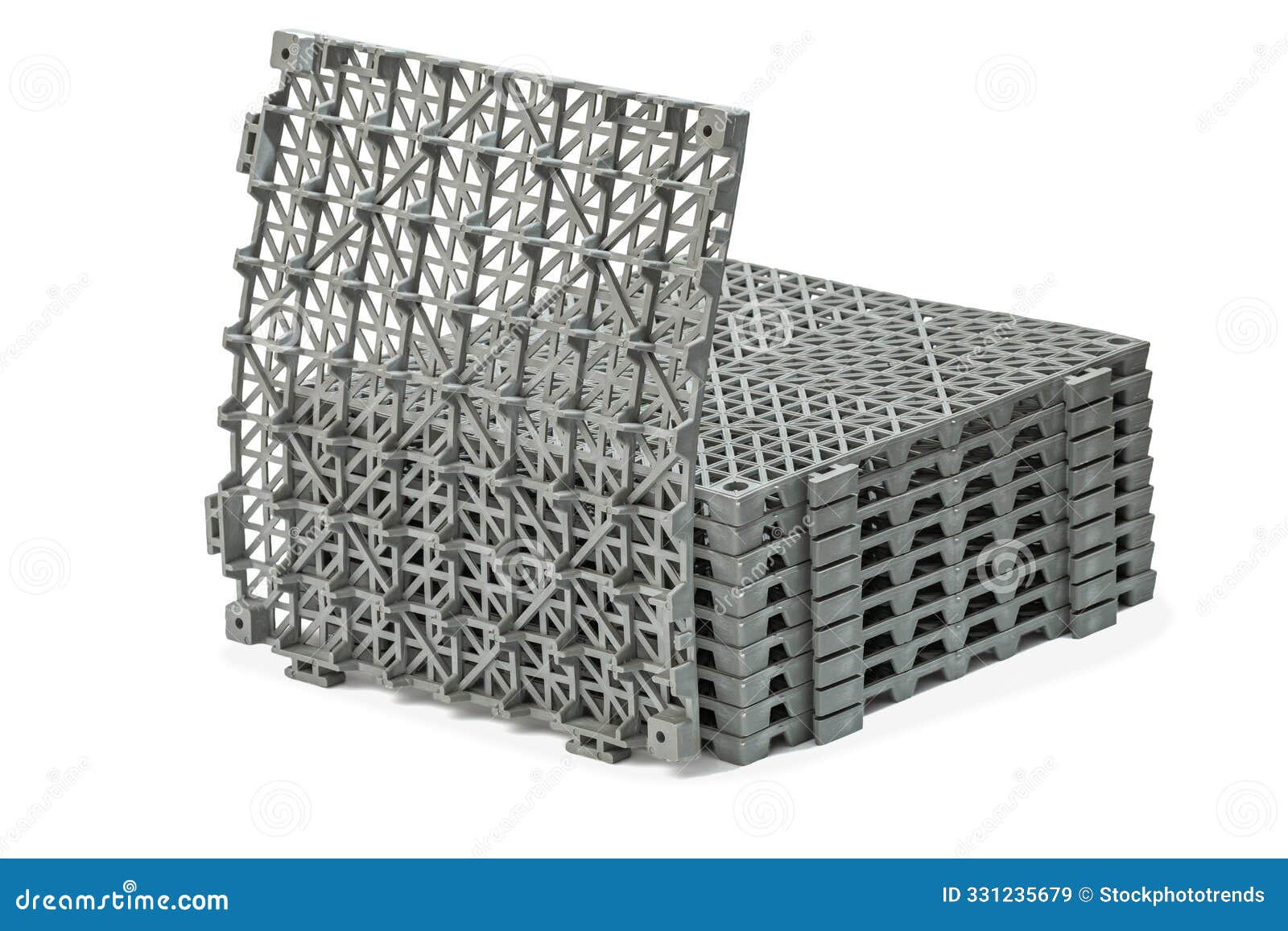 stack of anti-slip rubber mats in the bathroom,  on white background panels have a grid-like pattern on their surface,