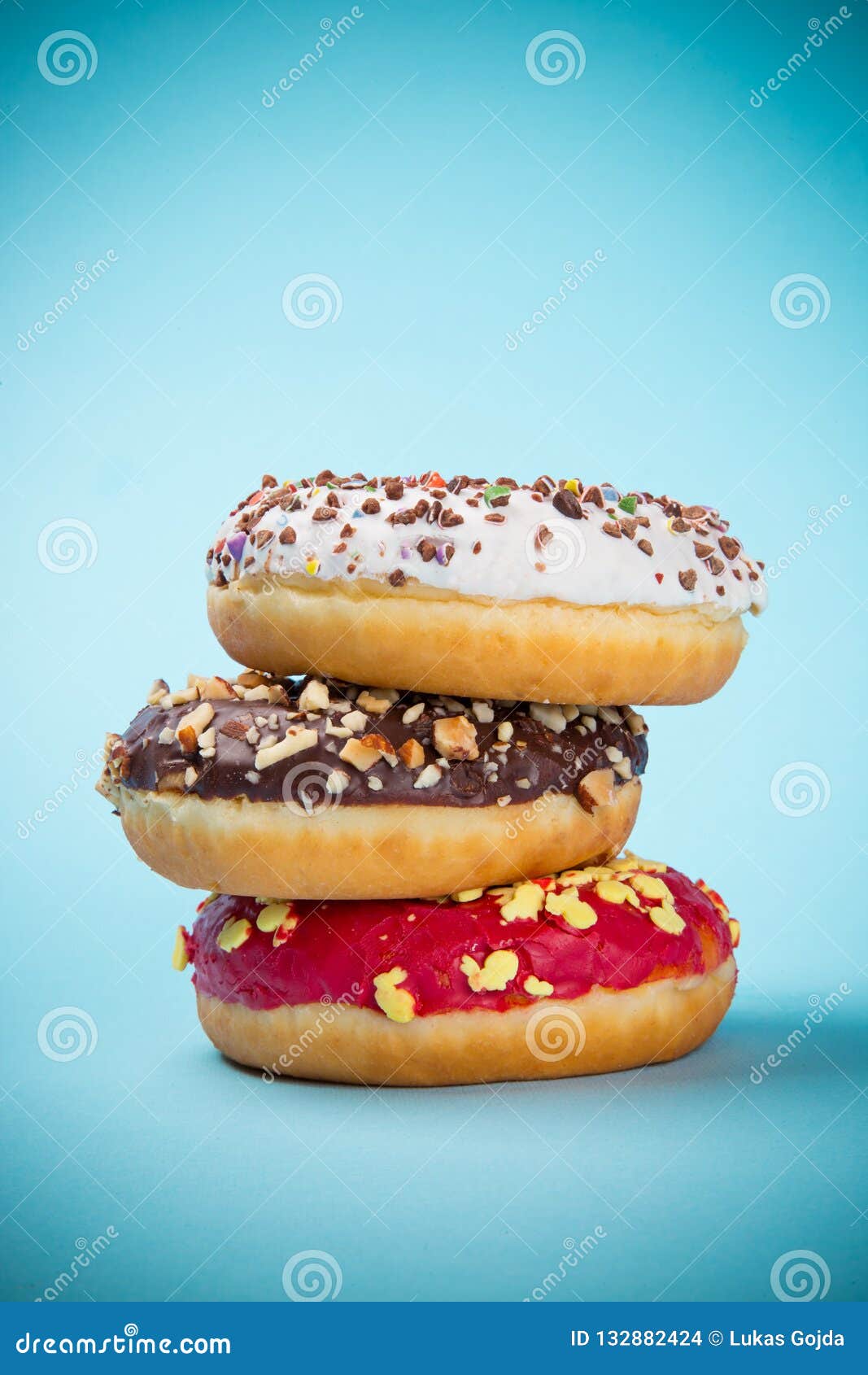 Stack of Assorted Donuts on Pastel Background. Stock Photo Image of doughnut, colorful 132882424