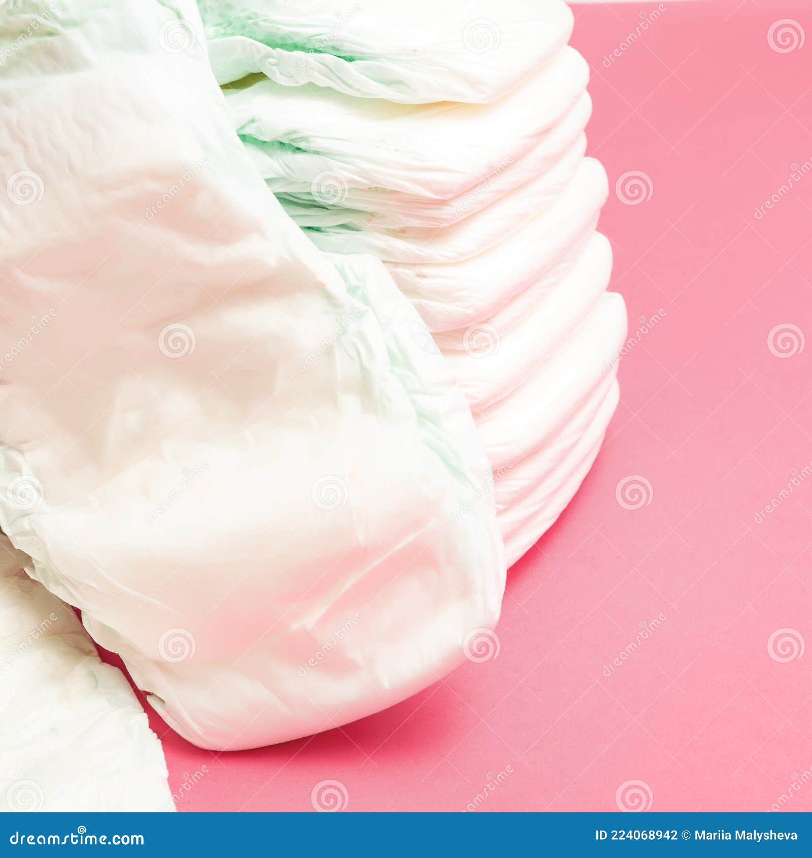 Stack of Baby Disposable Diapers on Pink Background Stock Photo Image