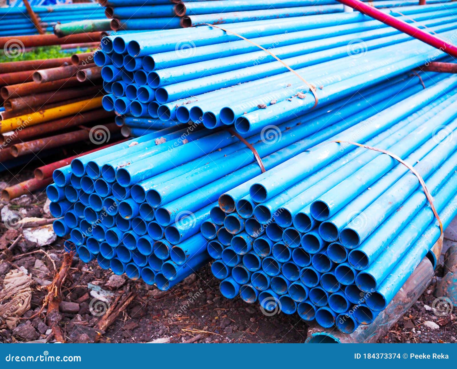 Stack of Blue Plumbing Pipes in Construction Site Stock Photo Image