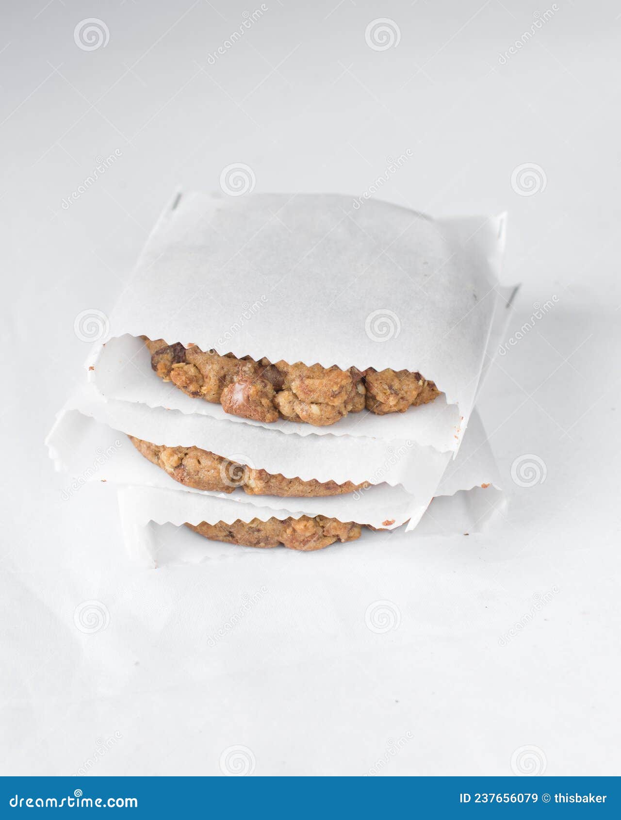 Stack of Chocolate Chip Cookies Individually Packed in White Parchment
