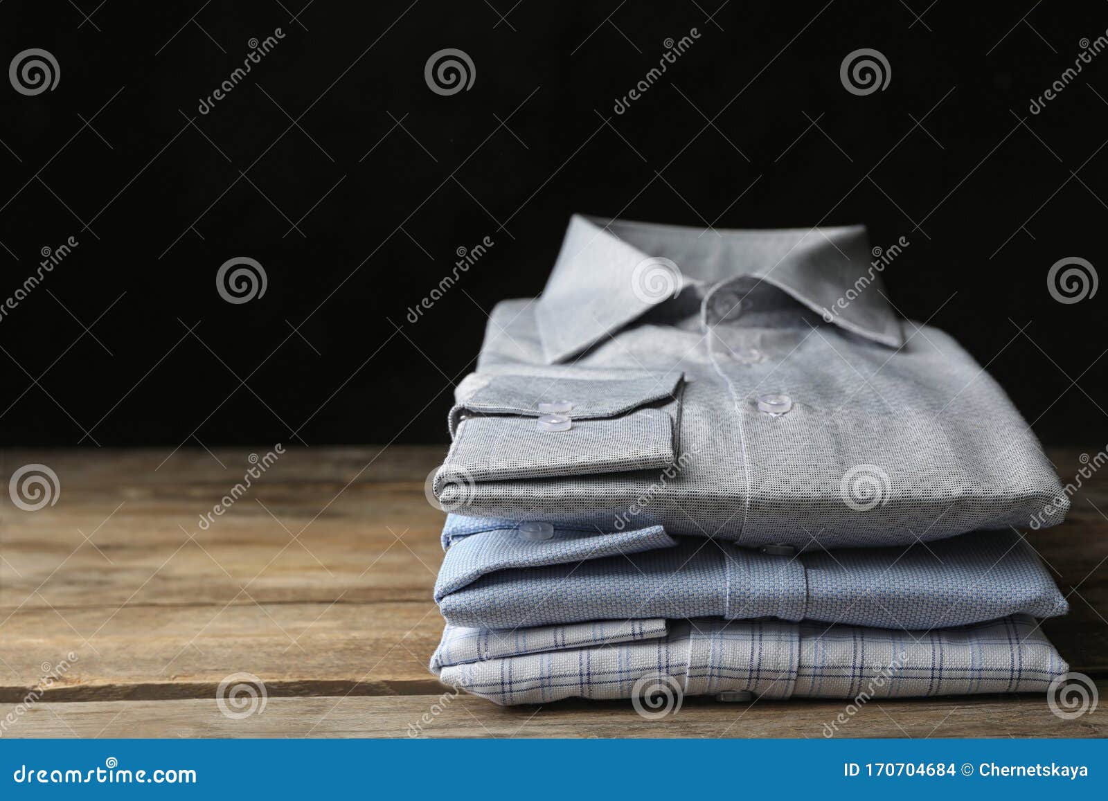 Stack of Classic Shirts on Table Stock Photo - Image of black, design ...