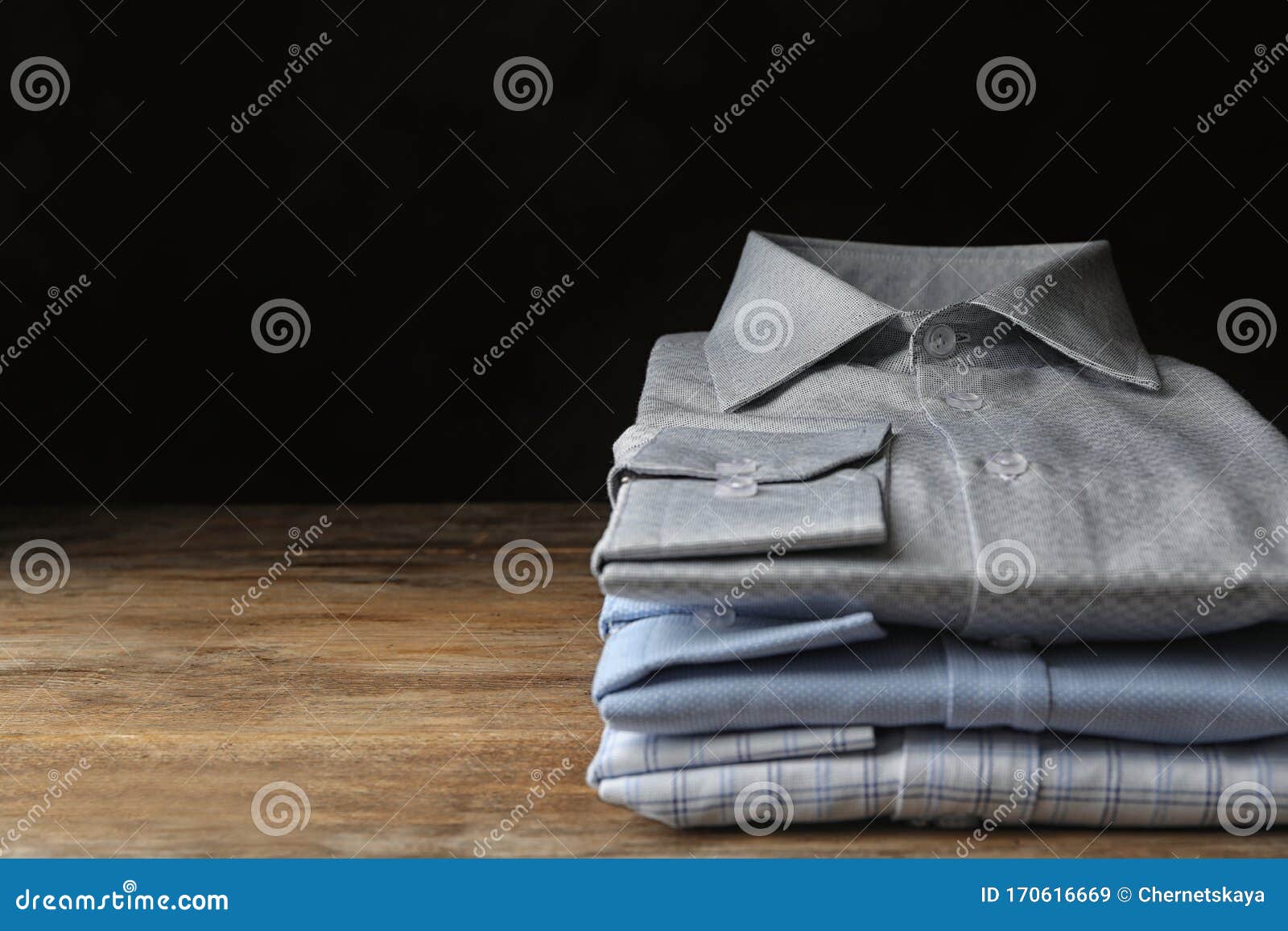 Stack of Classic Shirts on Wooden Table. Space for Text Stock Image ...