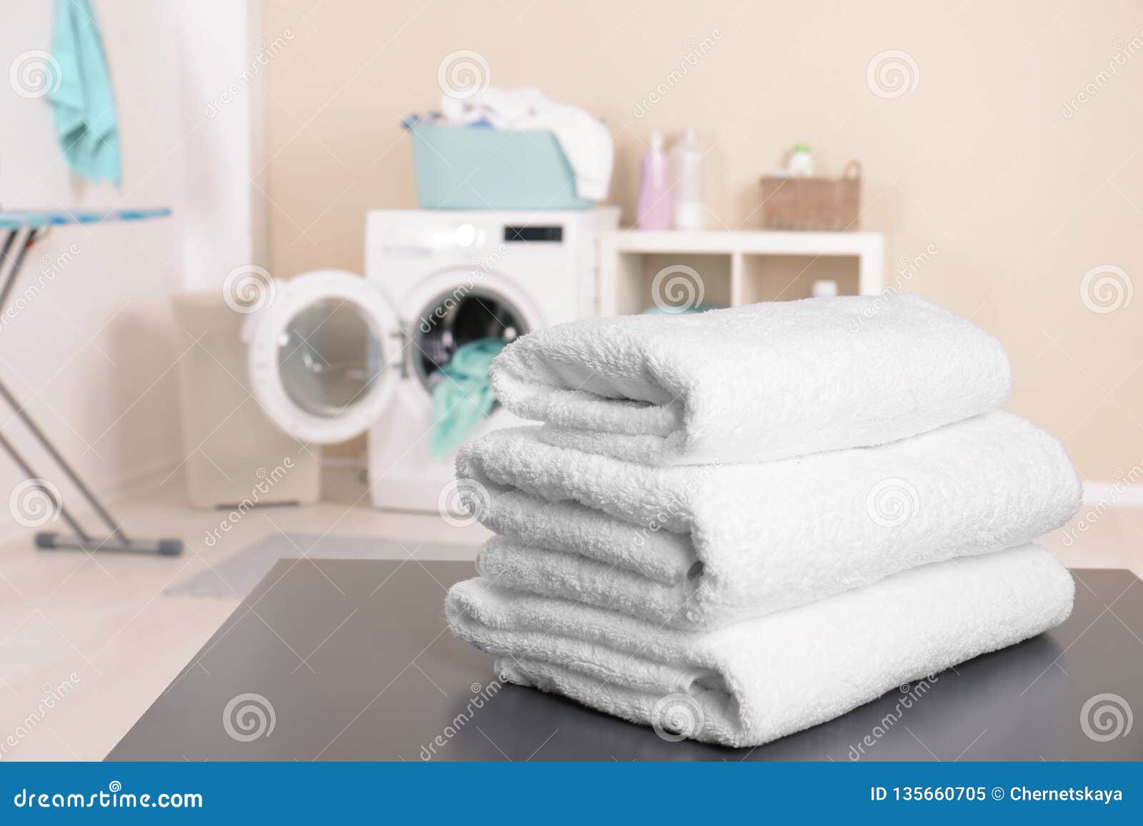 Stack of Clean Towels on Table in Laundry Room Stock Image Image of