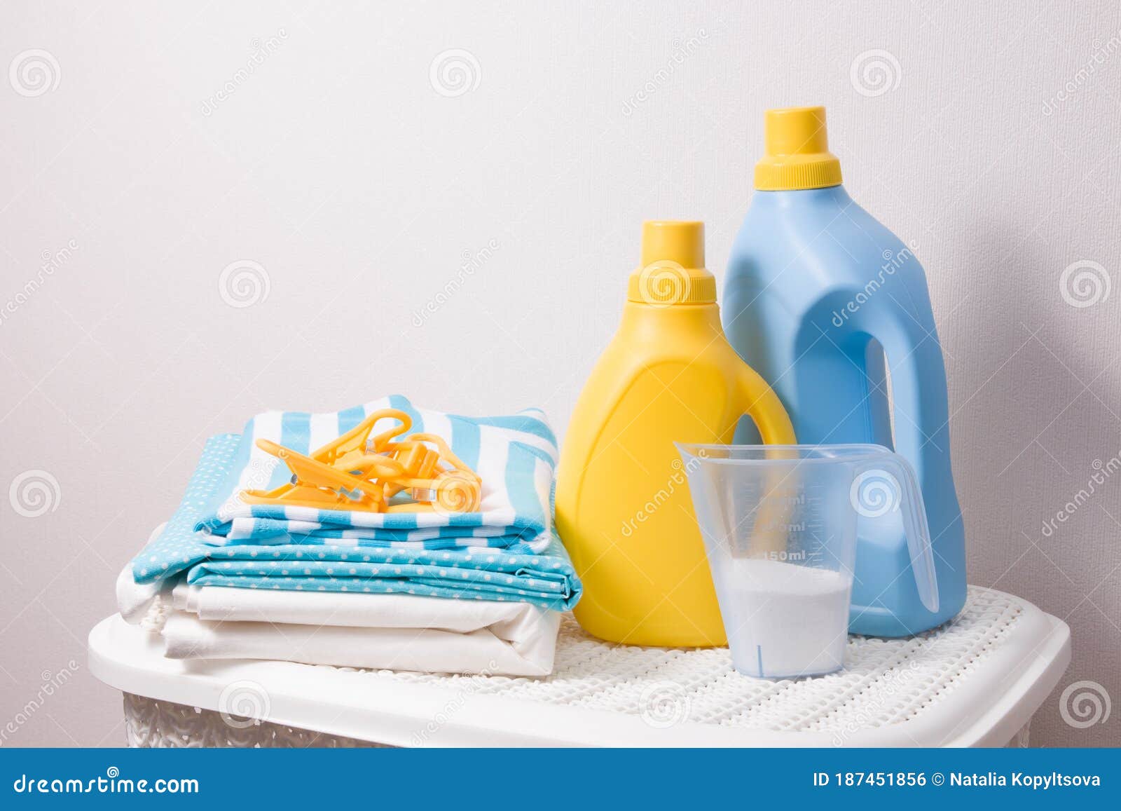 A Stack of Colored Laundry, Clothes Pegs, Laundry Detergent in a Measuring  Cup Stock Photo - Image of detergent, household: 187451856