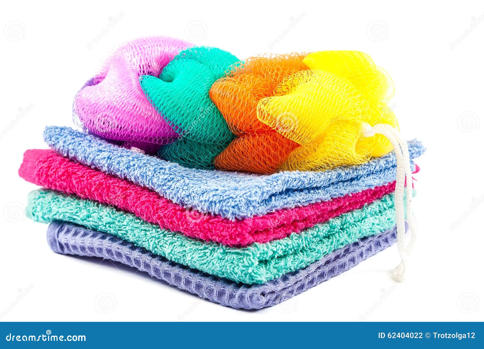 Stack of Colored Towels and Bath Sponge. Stock Photo Image of green