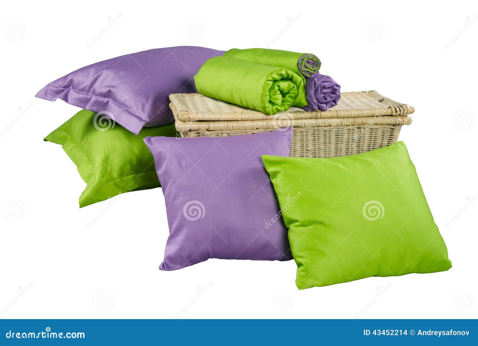 Stack of Colorful Pillows and Twisted Blankets on Basket Isolate Stock