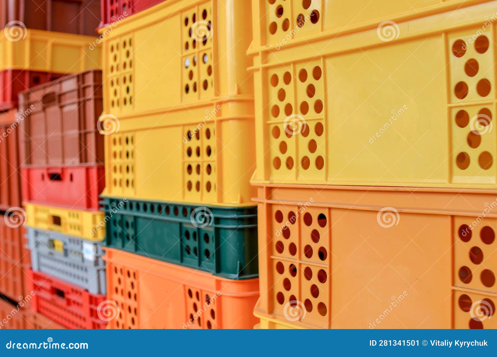 Stack of Colorful Plastic Crates or Boxes for Transporting Bakery and