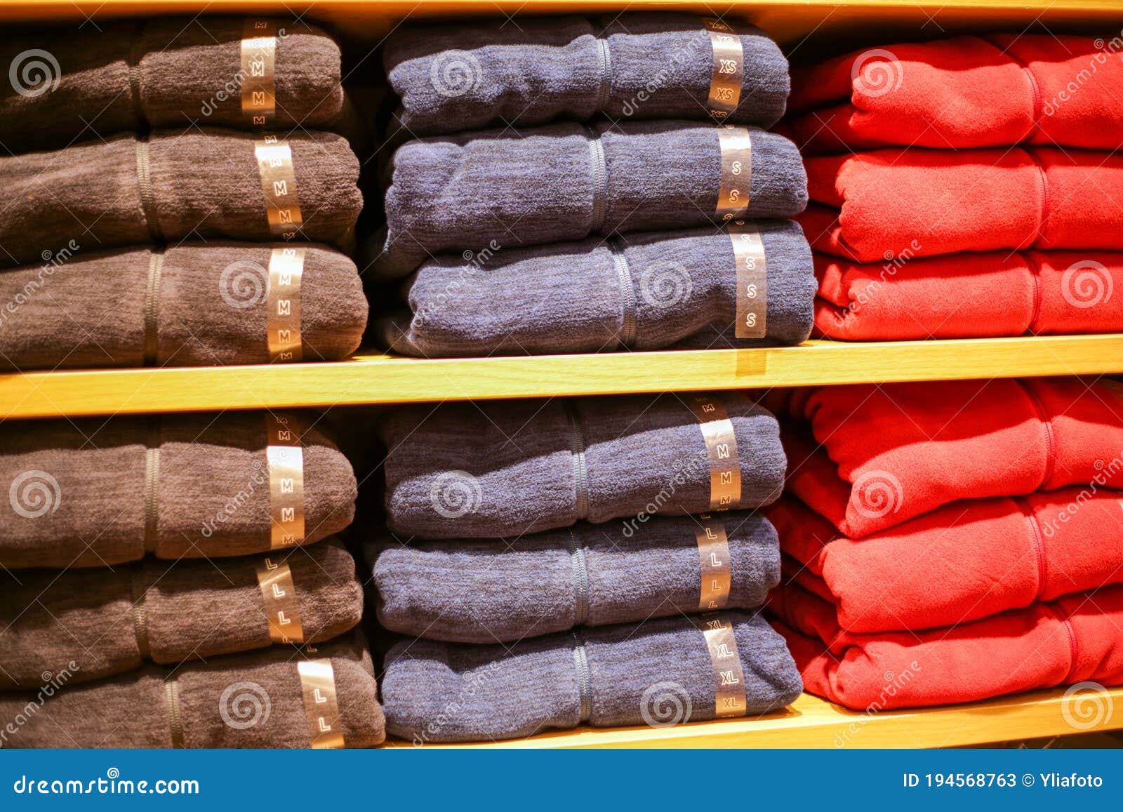 Stack of Colorful T-shirts on the Shelf Stock Image - Image of shelf