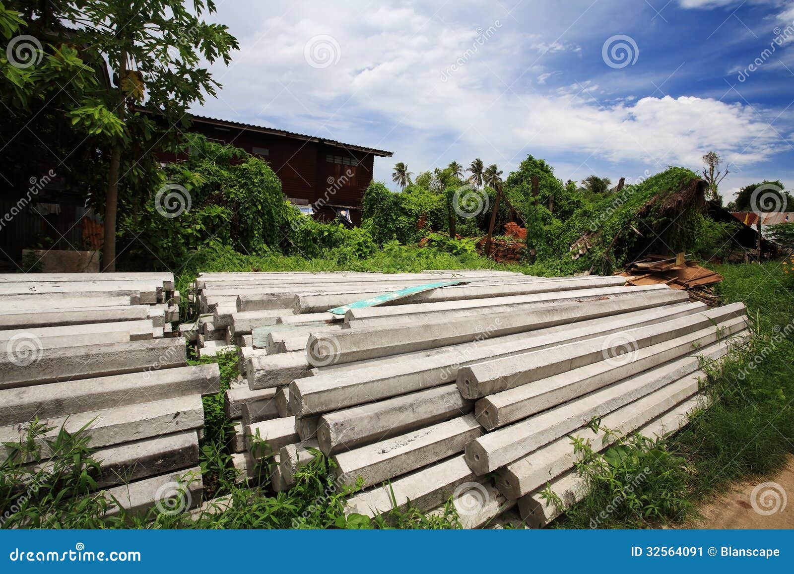 Stack Of Concrete Pillars For Construction Stock Image - Image of board