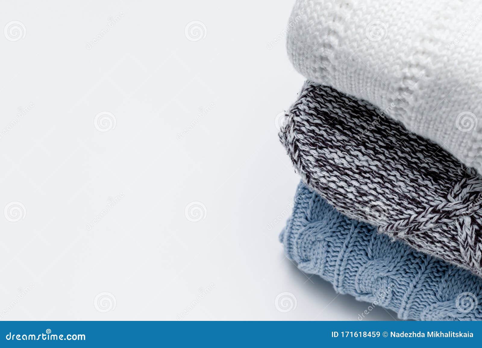 Stack Of Cozy Comfortable Homely Clean Washed Knitted Pullovers In