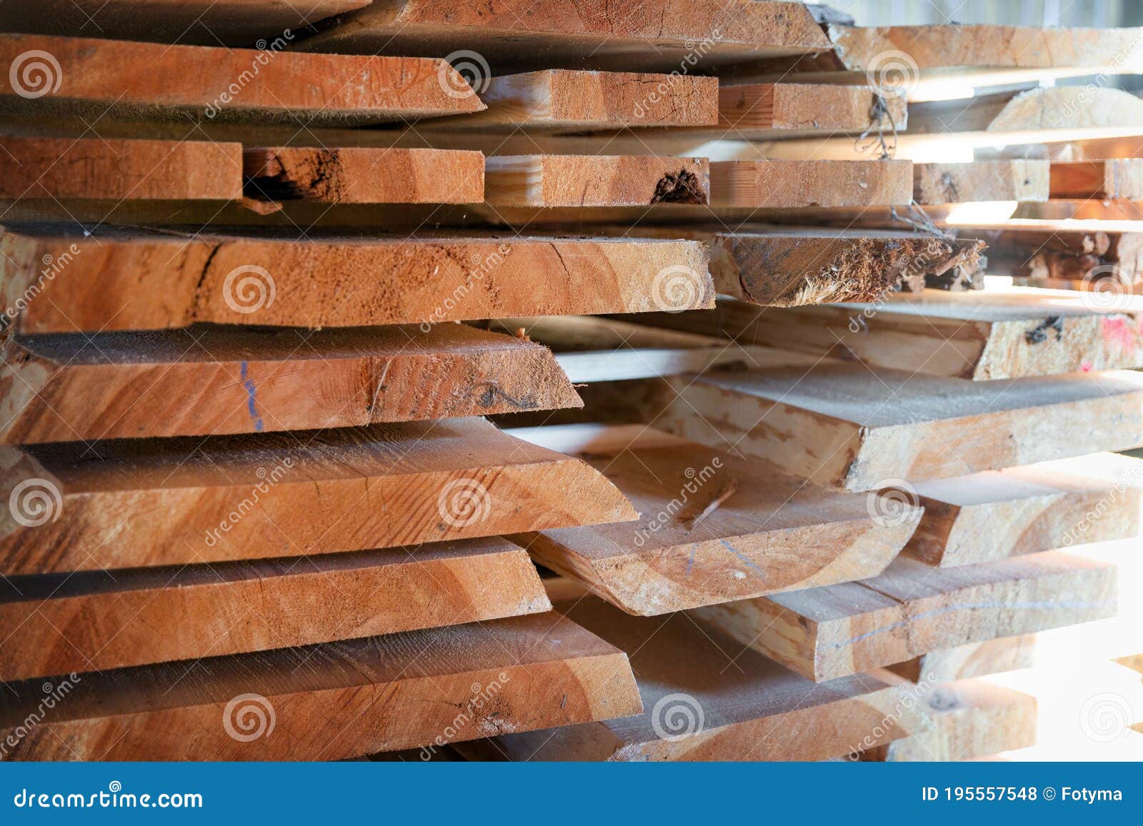 Stack of cut wooden boards stock photo. Image of plank 195557548