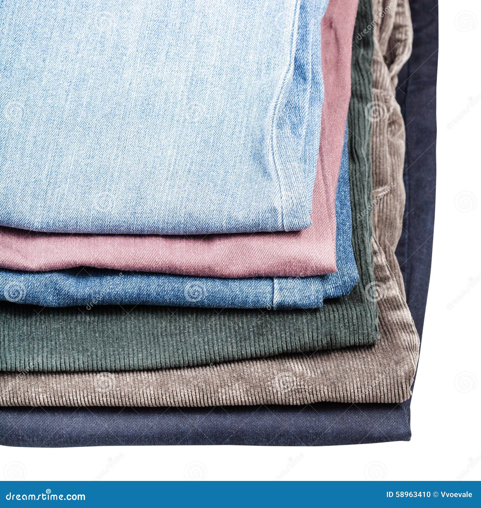 stack of different jeans and corduroys close up
