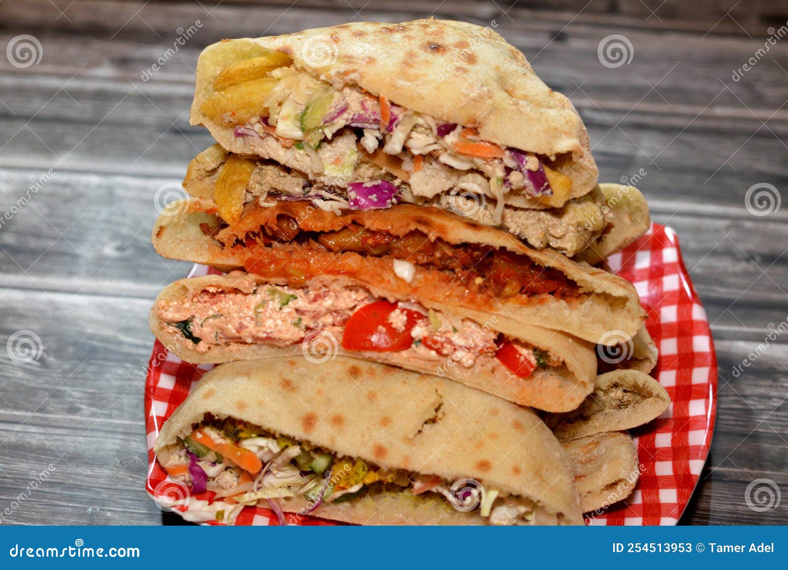 Stack Of Egyptian Popular Street Sandwiches Of Mashed Fava Beans Fried Crispy Falafel Balls