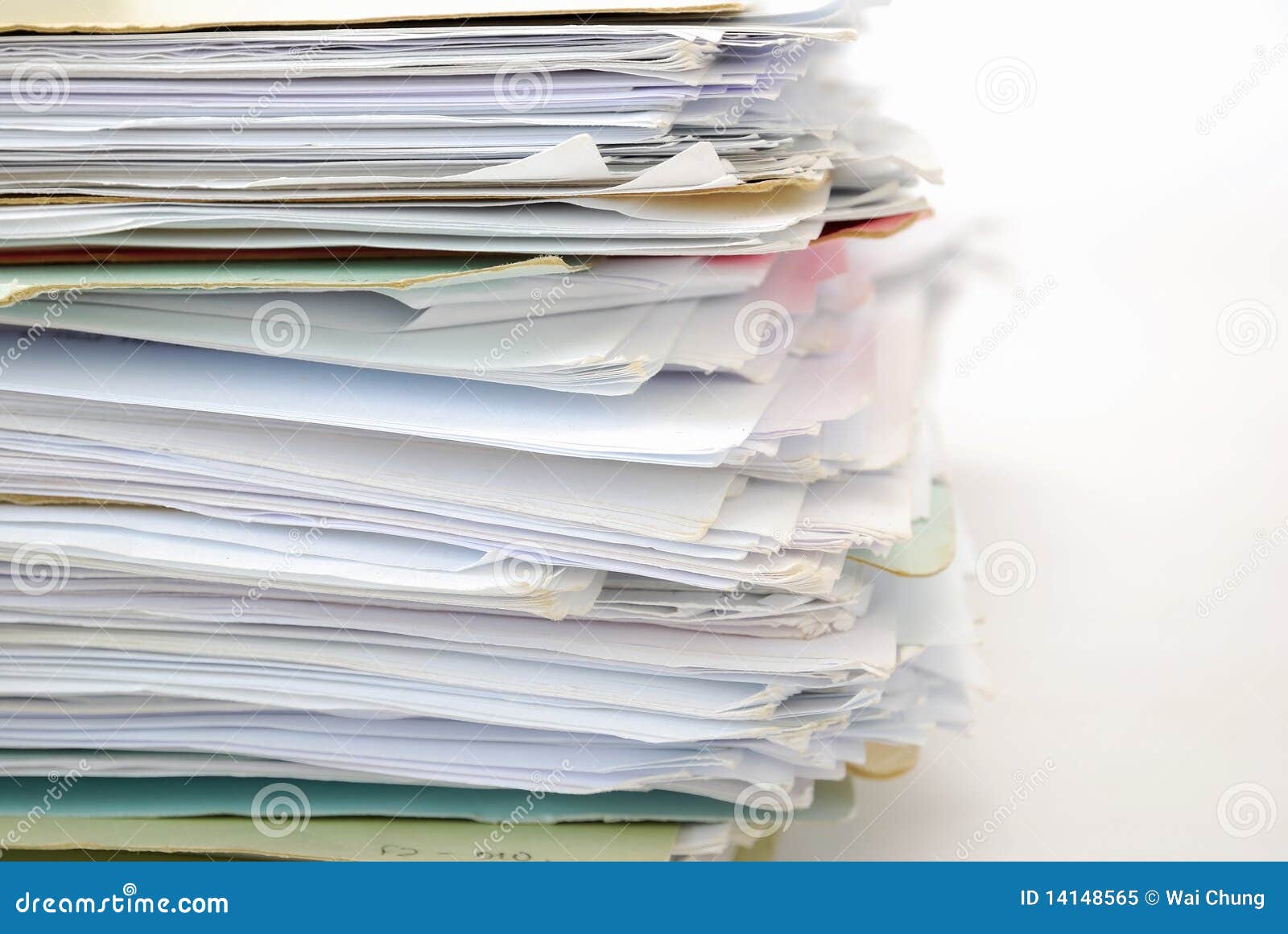 stack of files full of documents
