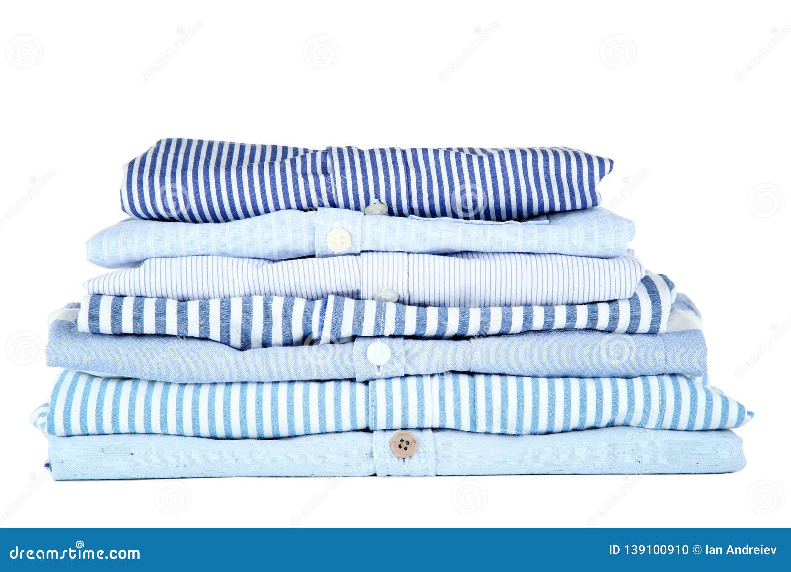 Stack of folded shirts stock photo. Image of color, background - 139100910