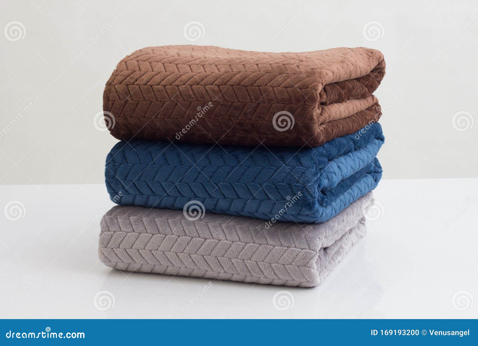 stack of folded soft blankets 
