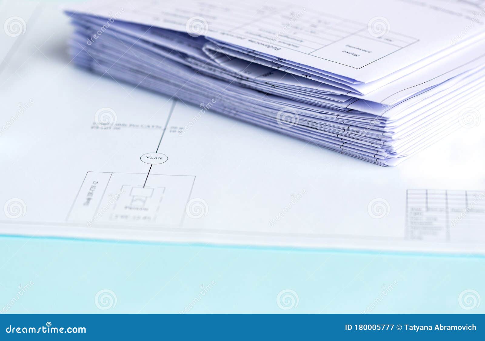 stack folding drawings on a blue background. top view. flat lay. copy space. technical project drawing.