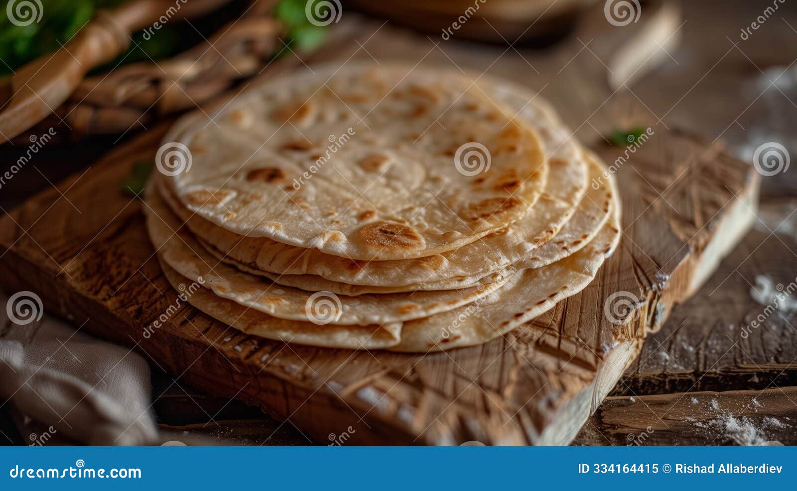 stack of fresh tortillas on wooden board