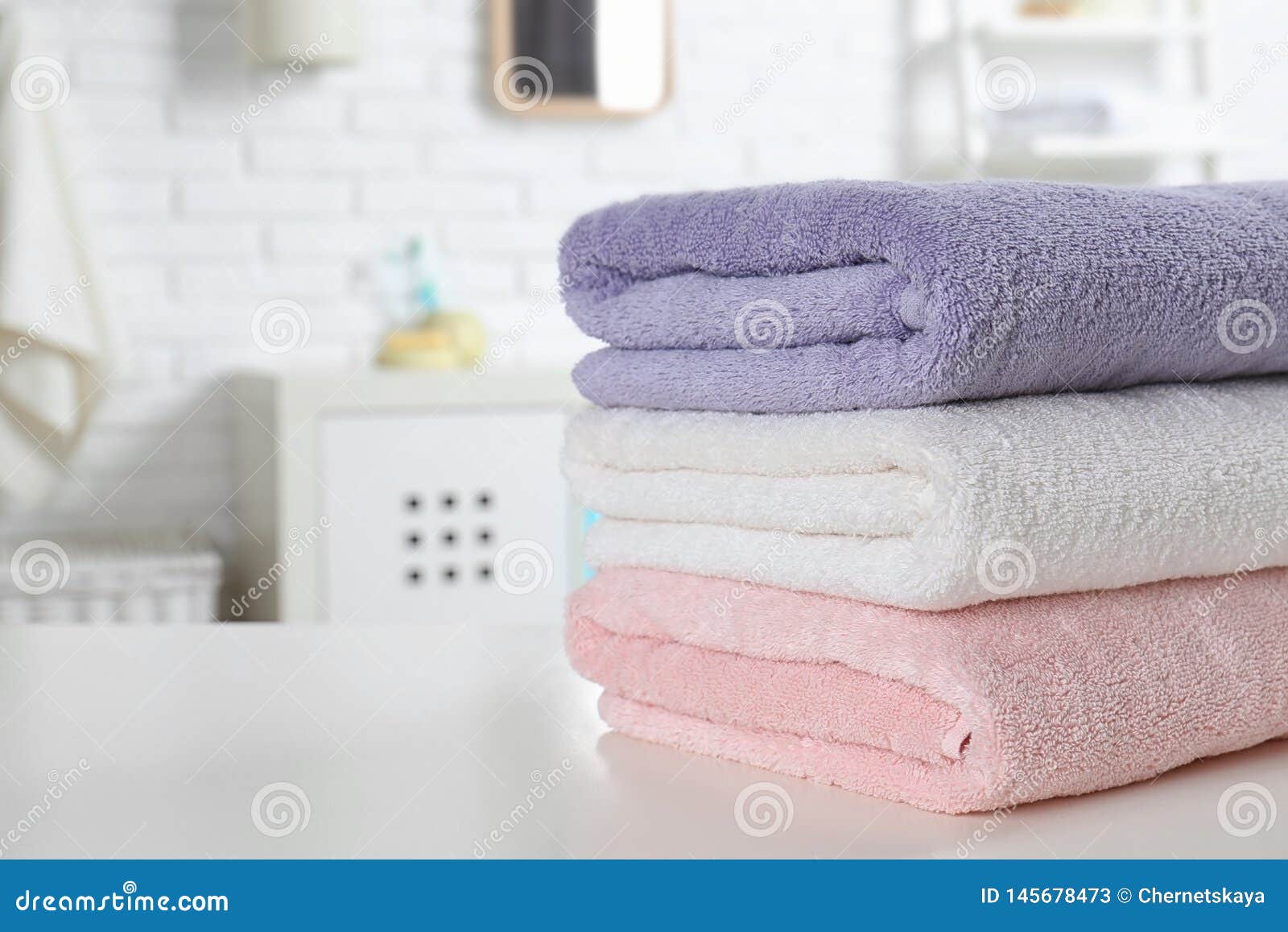 Stack of Fresh Towels on Table in Bathroom, Closeup Stock Image Image