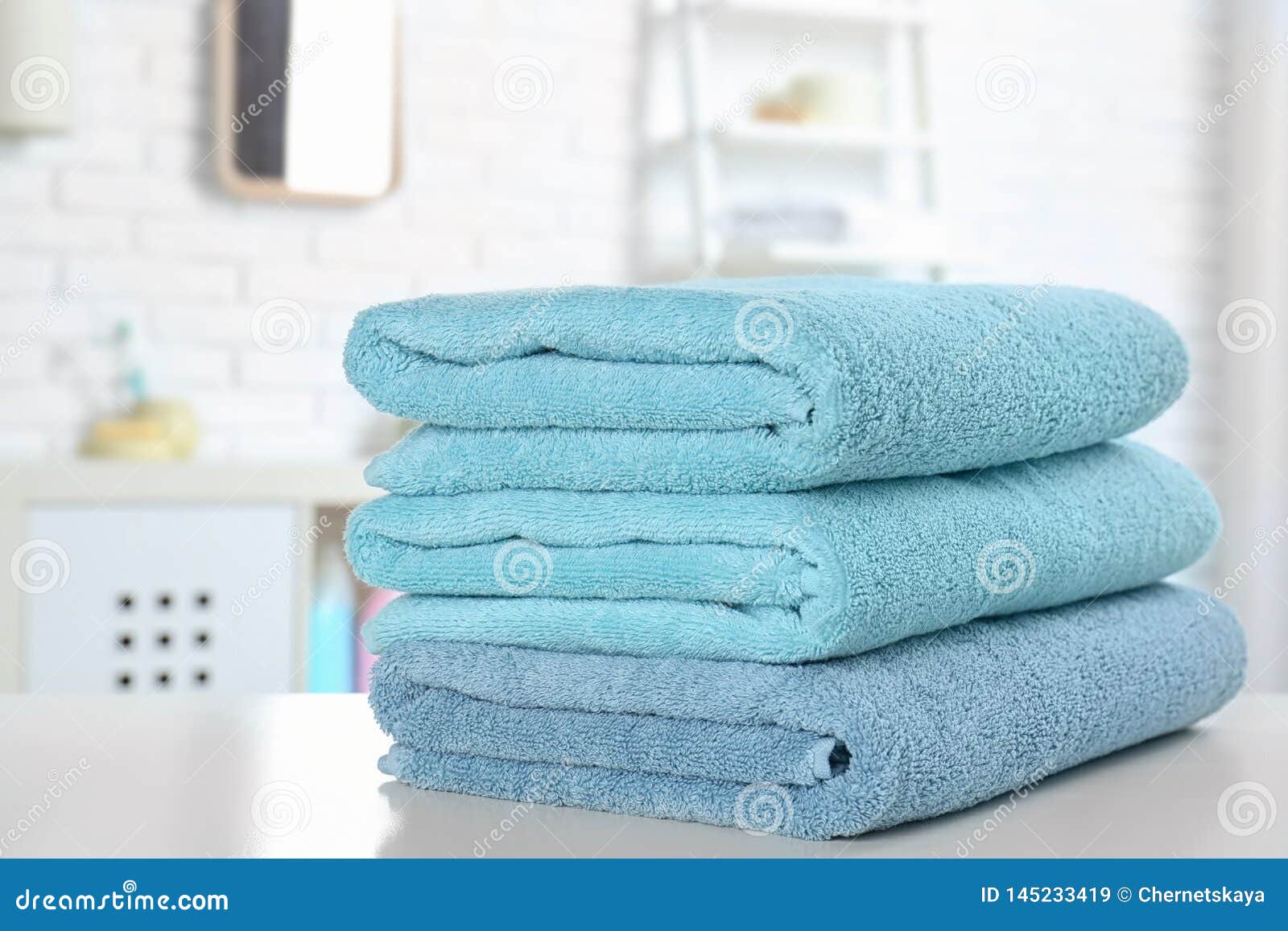 Stack of Fresh Towels on Table in Bathroom Stock Image Image of