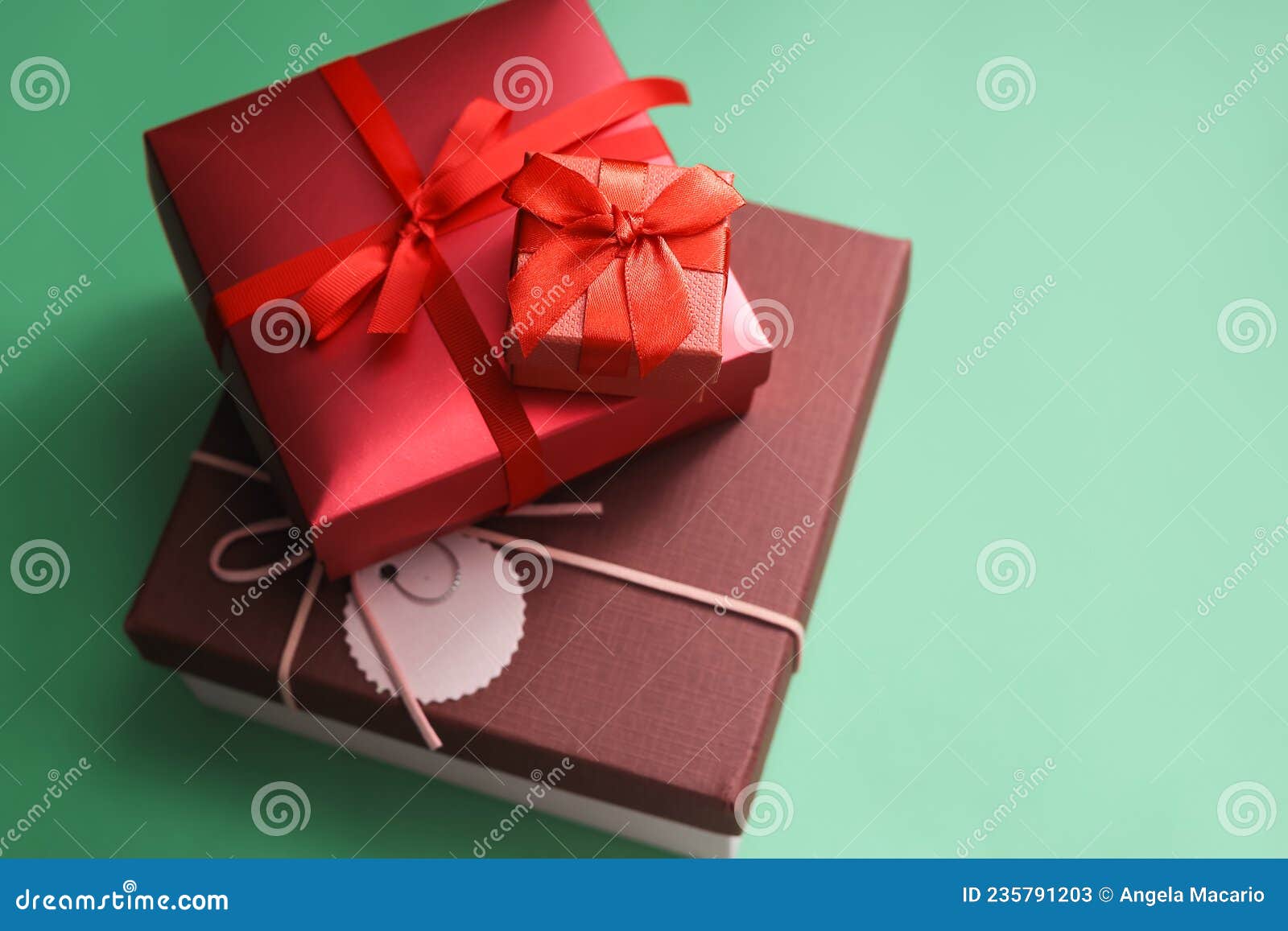 A Stack of Gift Boxes on a Green Surface. Stock Image Image of