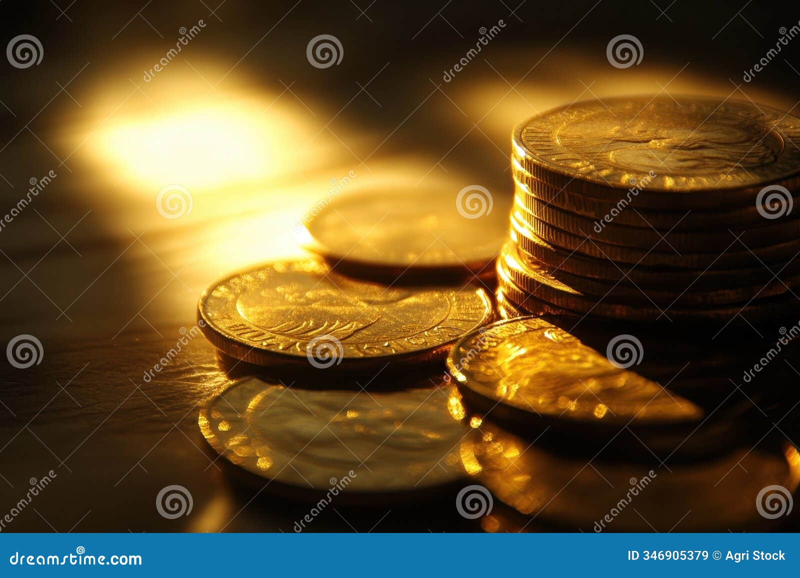 stack of gold coins illuminated by warm light