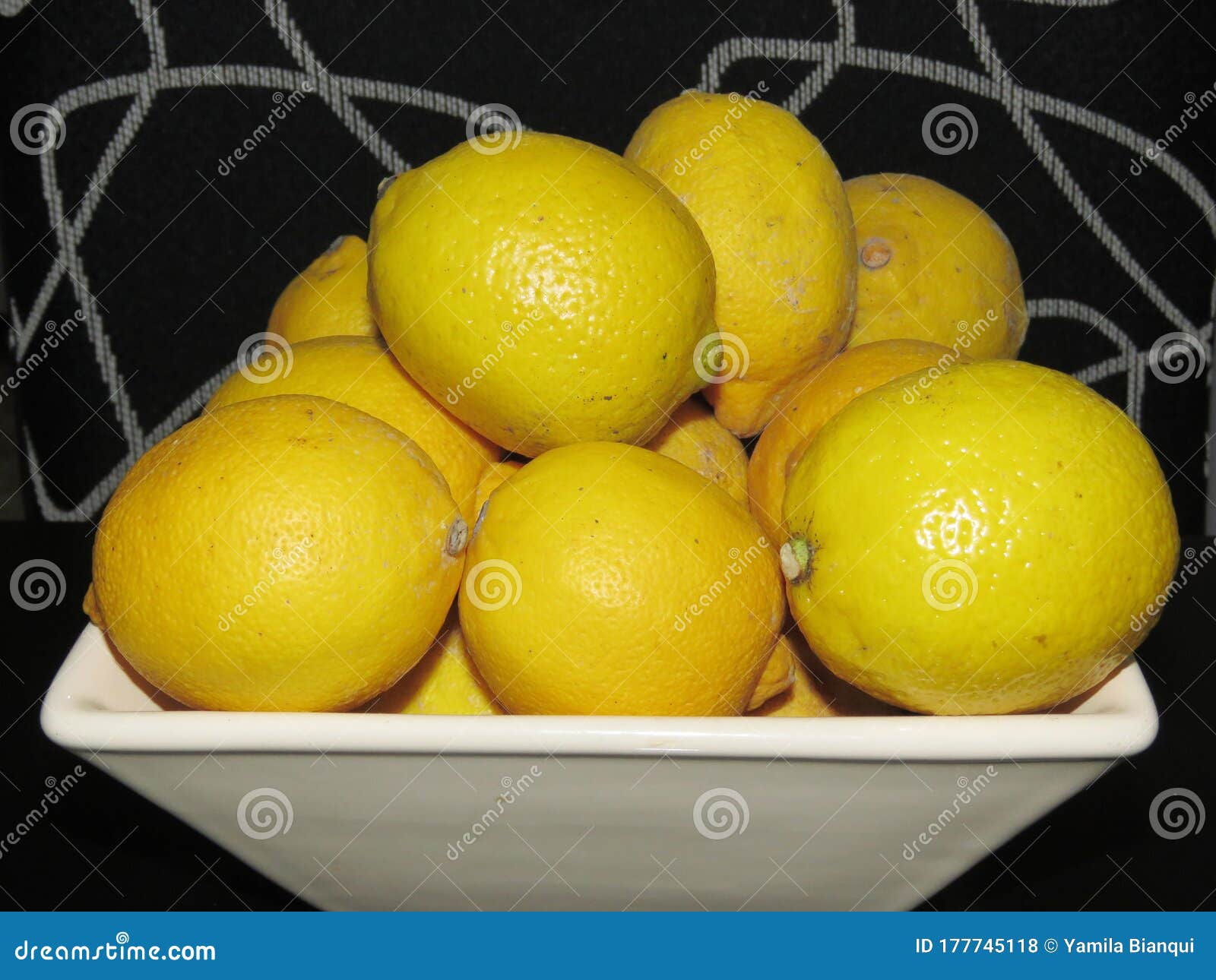 stack of imperfect lemons on black and white background