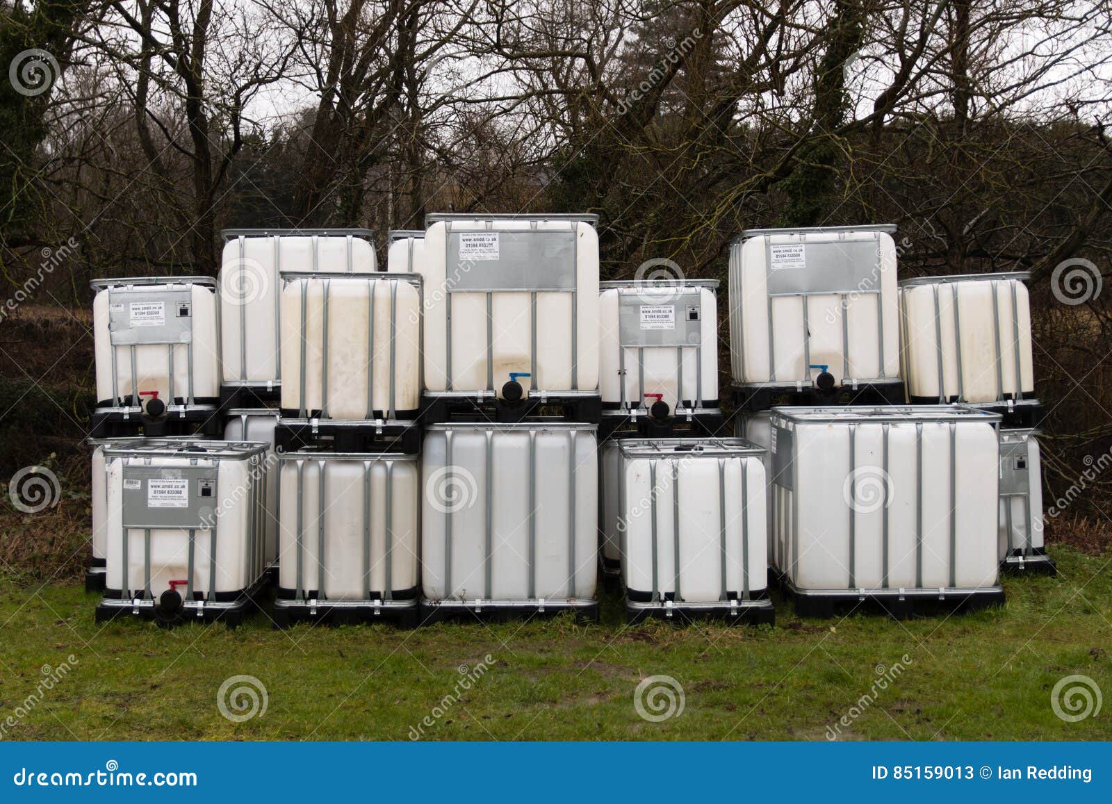 Stack of Intermediate Bulk Containers Outdoors Editorial Stock Photo