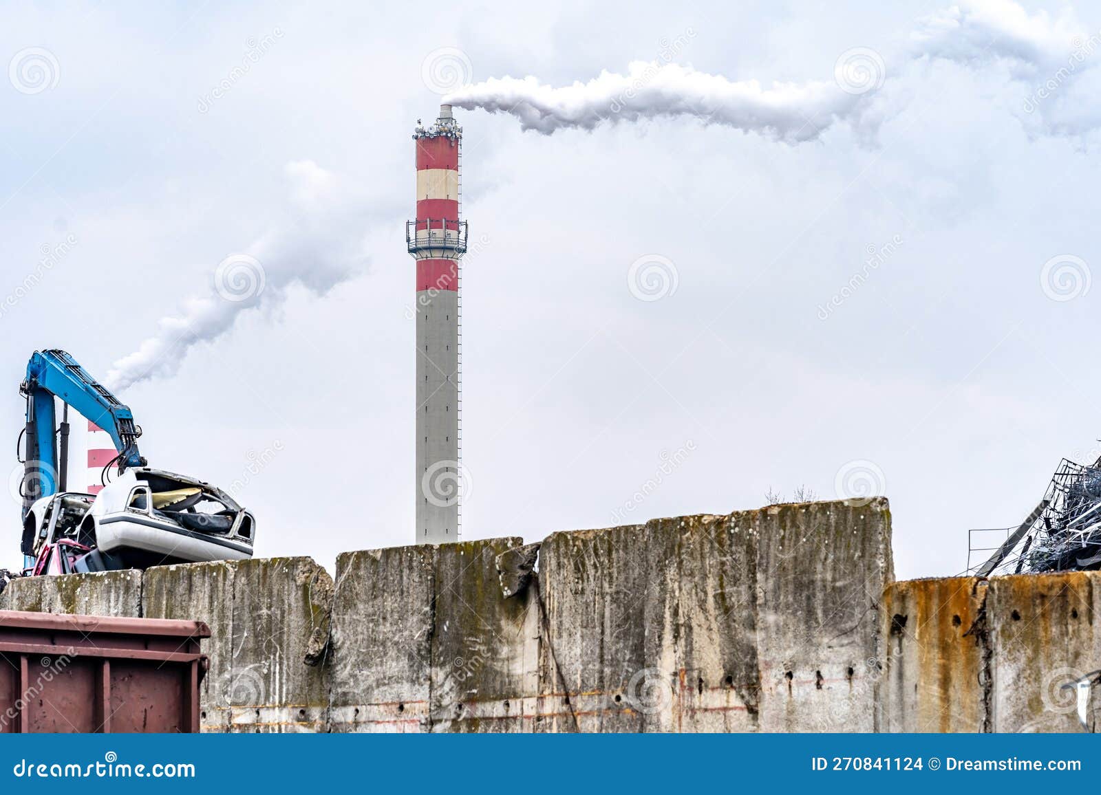 A Stack of Iron Loaded on a Train and a Smoking Chimney Editorial Stock