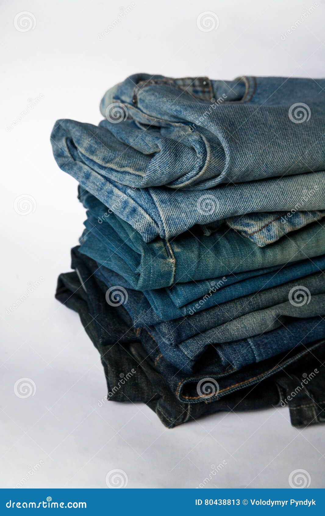 Stack of Jeans Fashion Background Different Denim Layers Colors Stock