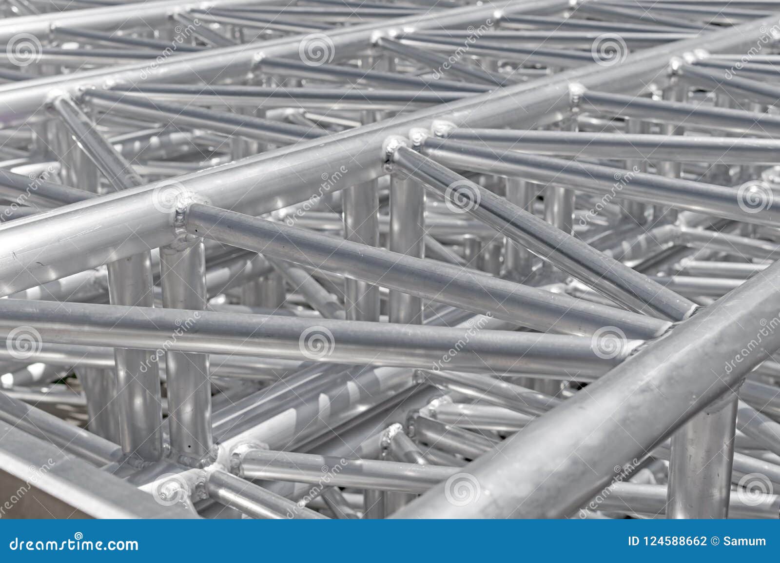 stack of metal trusses for mounting the stage