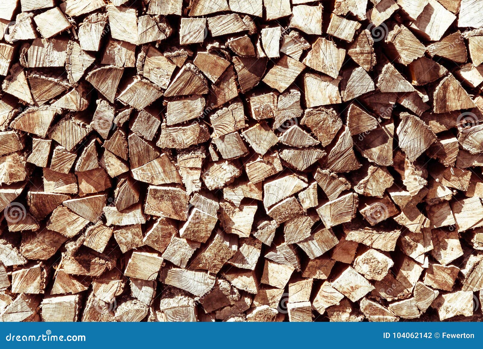 Stack of Natural Firewood in Preparation for the Winter and Used for