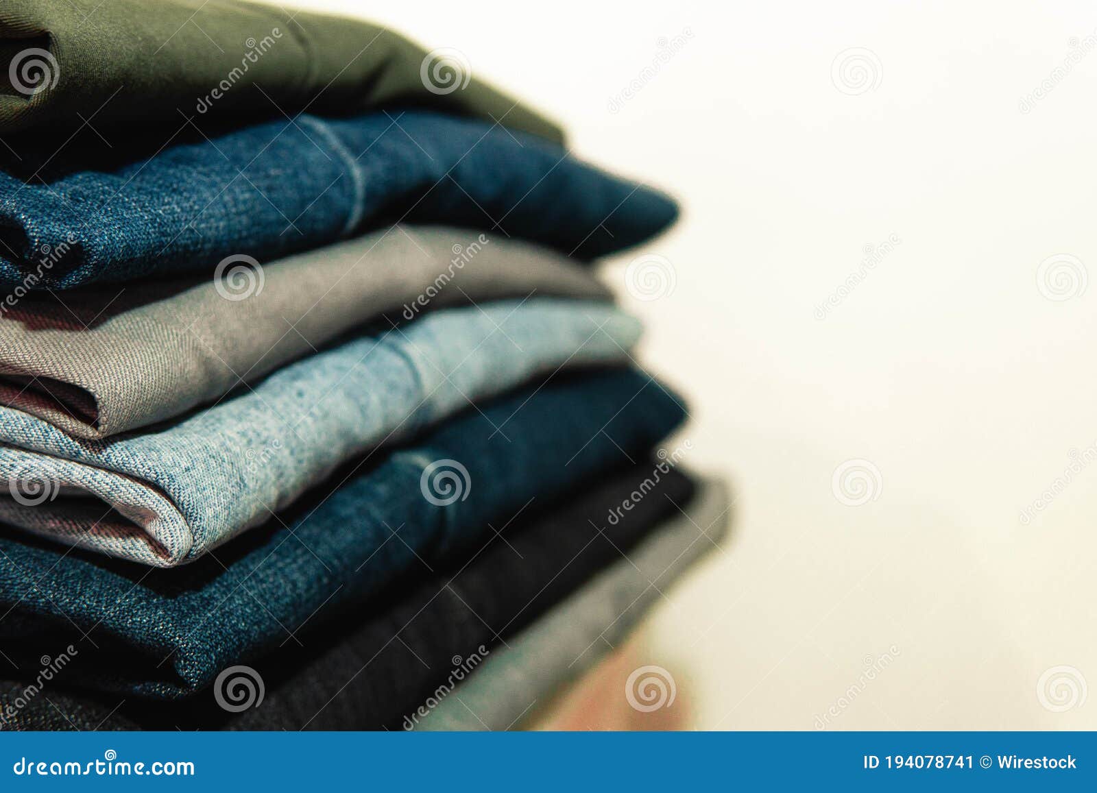 Stack of Neatly Folded Jeans on White Background Stock Image - Image of ...