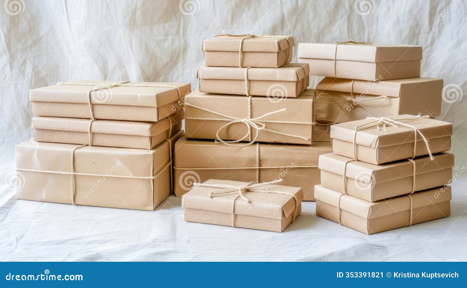 stack of neatly wrapped reusable kraft paper packages tied with twine
