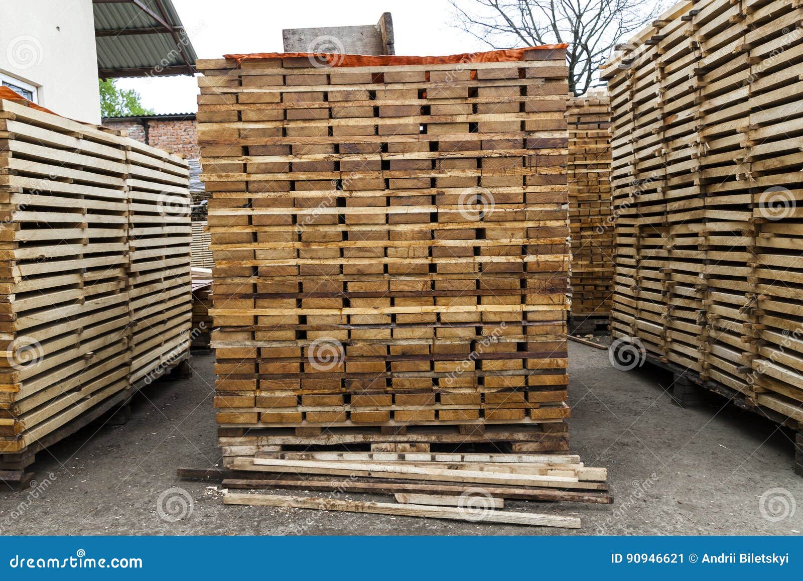 Stack of new wooden boards and studs at the lumber yard. Wooden plates on piles for furniture materials