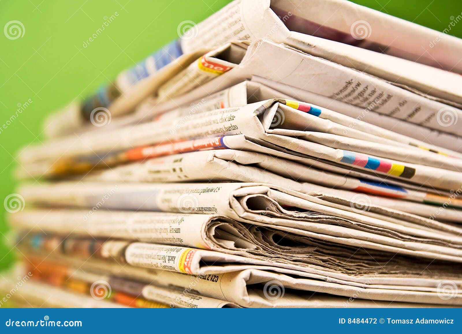 Stack of Newspapers in Color on Green Background Stock Photo Image of