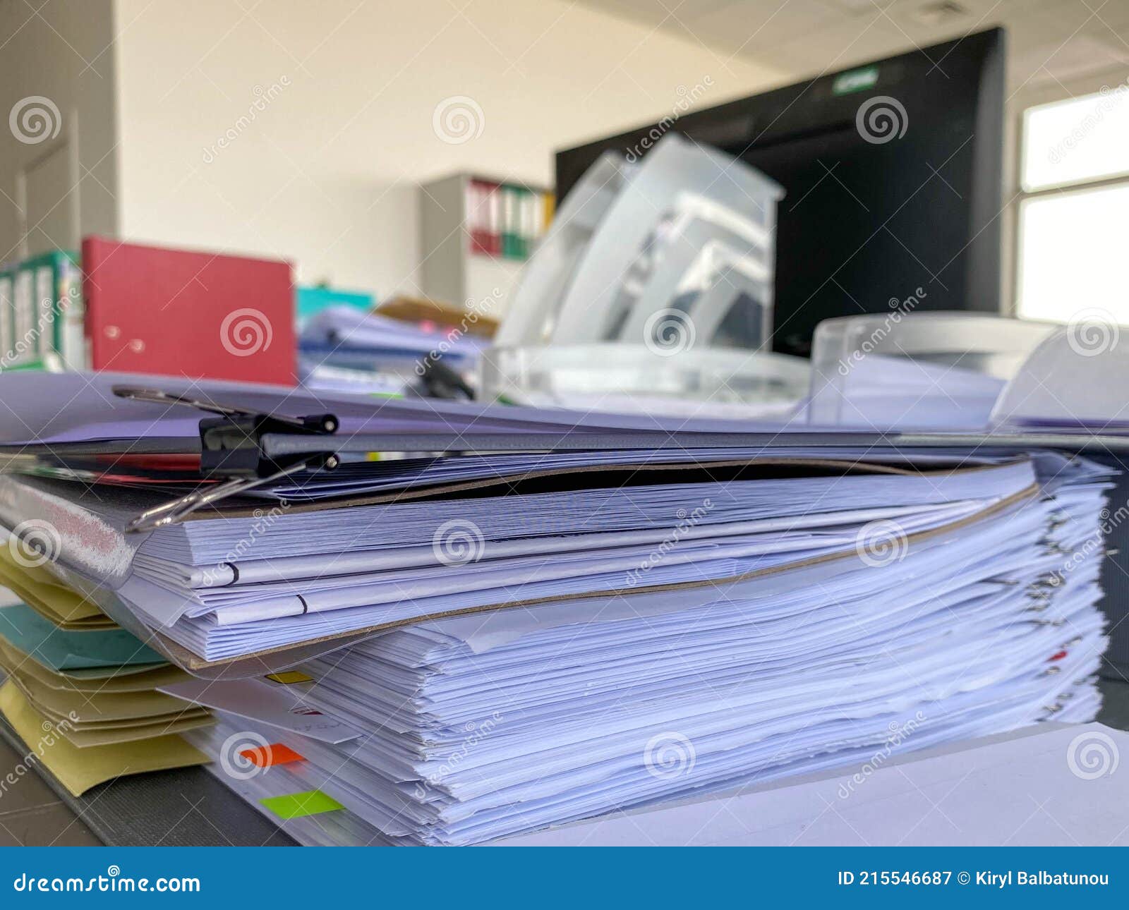 Stack of Papers Documents in Archives Files with Clip Papers on Table ...