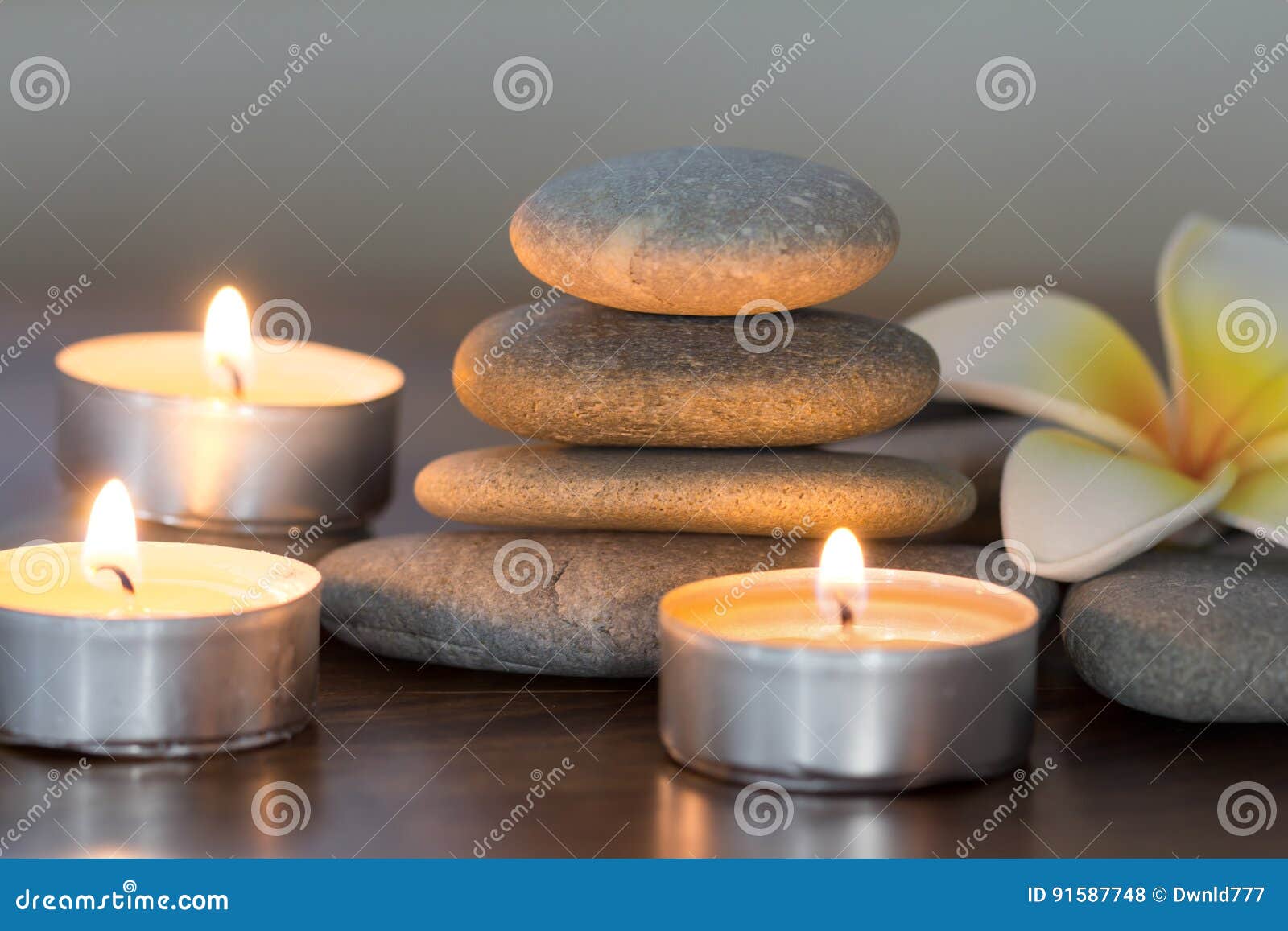 Stack of Pebble Stones and Burning Candles Stock Photo Image of table