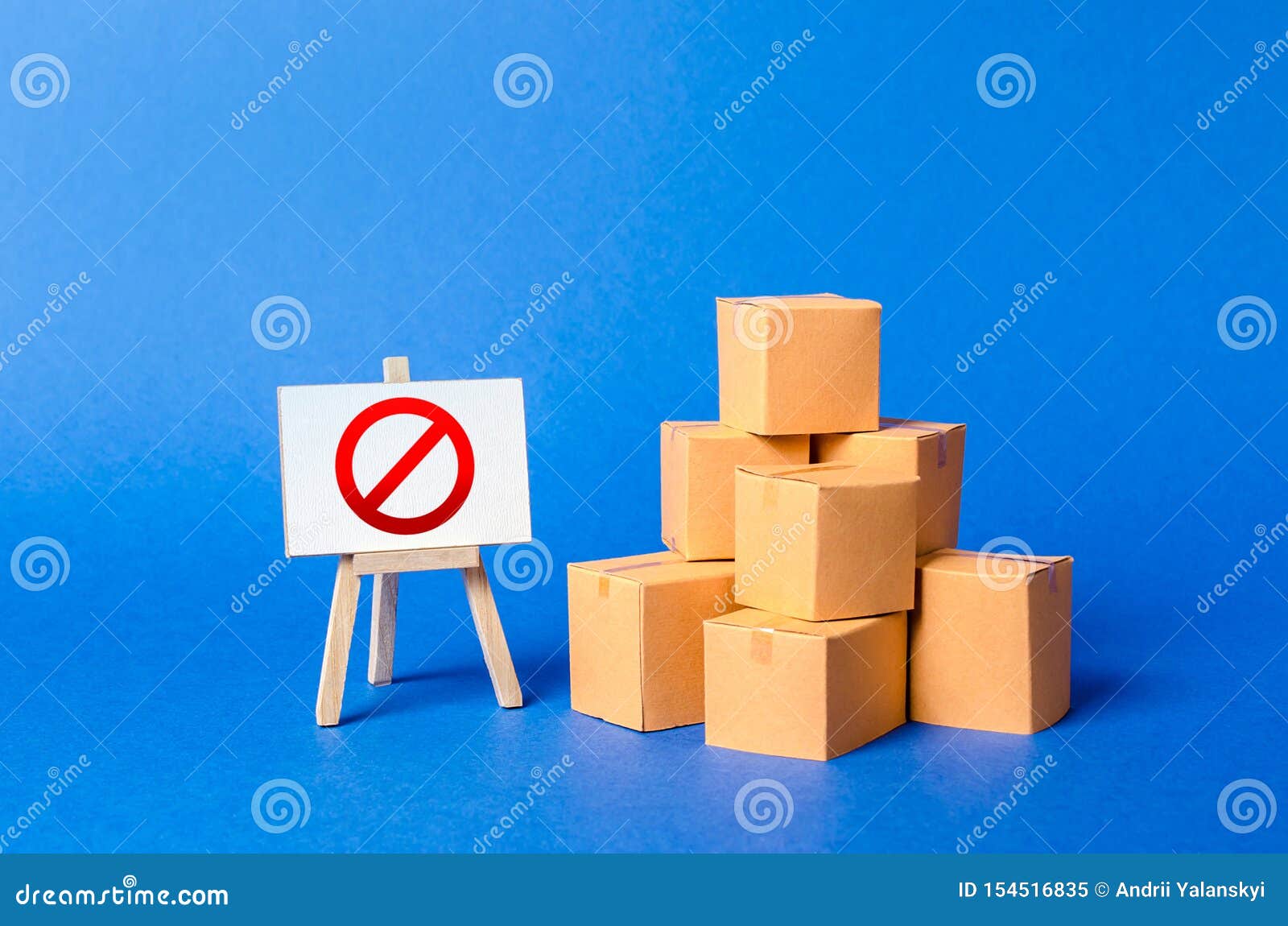 a stack pile cardboard boxes and a sign stand with red  no. restriction on the importation of goods, proprietary