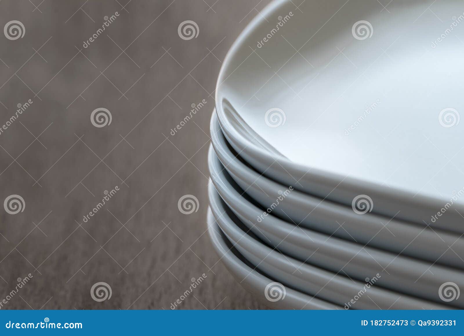 Stack Pile of Rectangular White Ceramic Dishes with Rounded Edges Stock