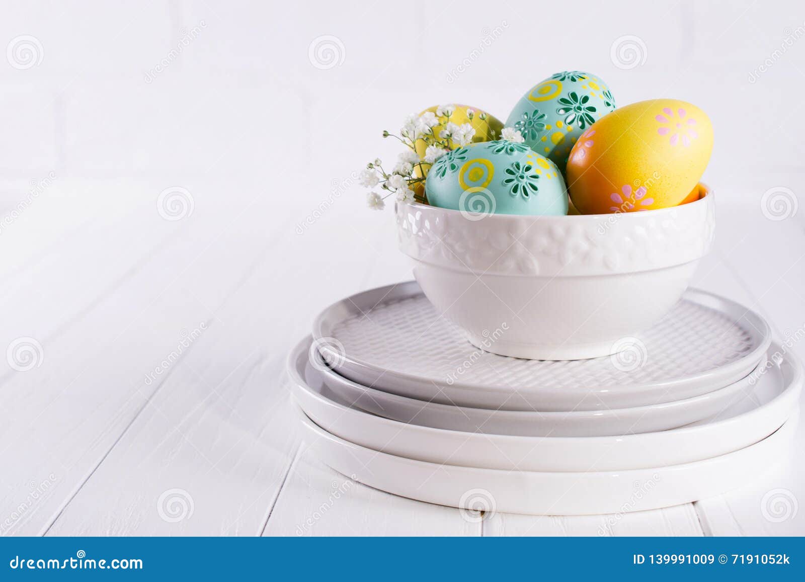 Stack of Plates and Bowl with Colorful Easter Eggs, Spring. Easter