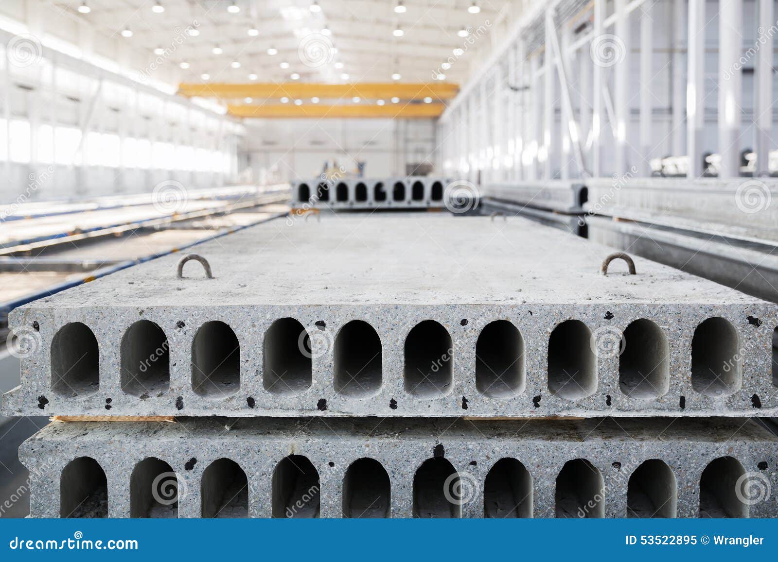 Stack of Reinforced Concrete Slabs in a Factory Workshop Stock Image