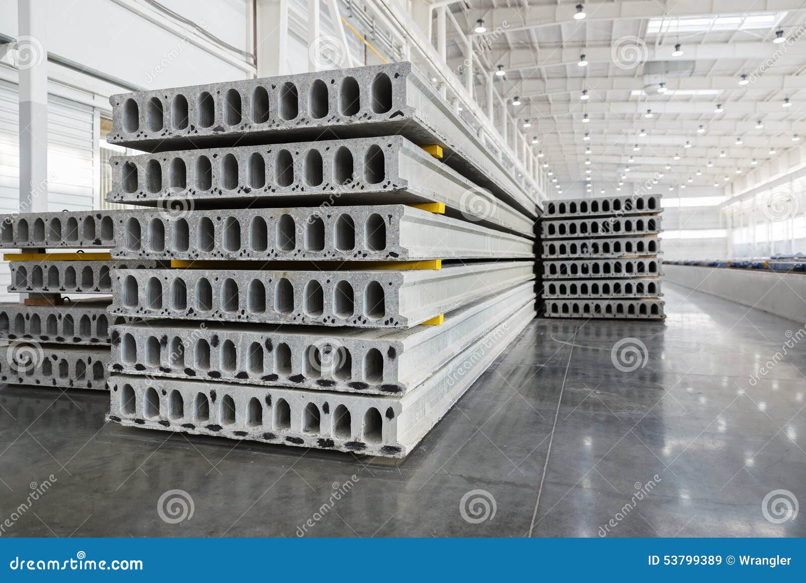 stack of reinforced concrete slabs in a factory workshop