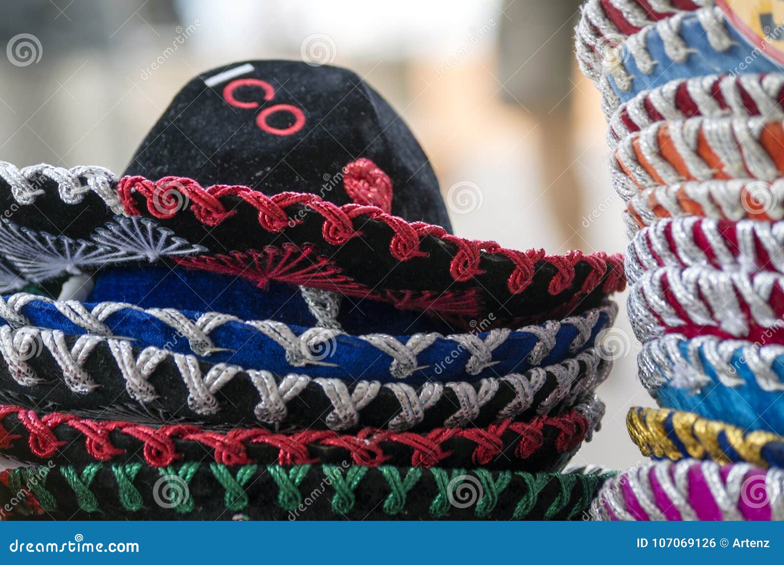 a stack of sombreros for sale in mexico