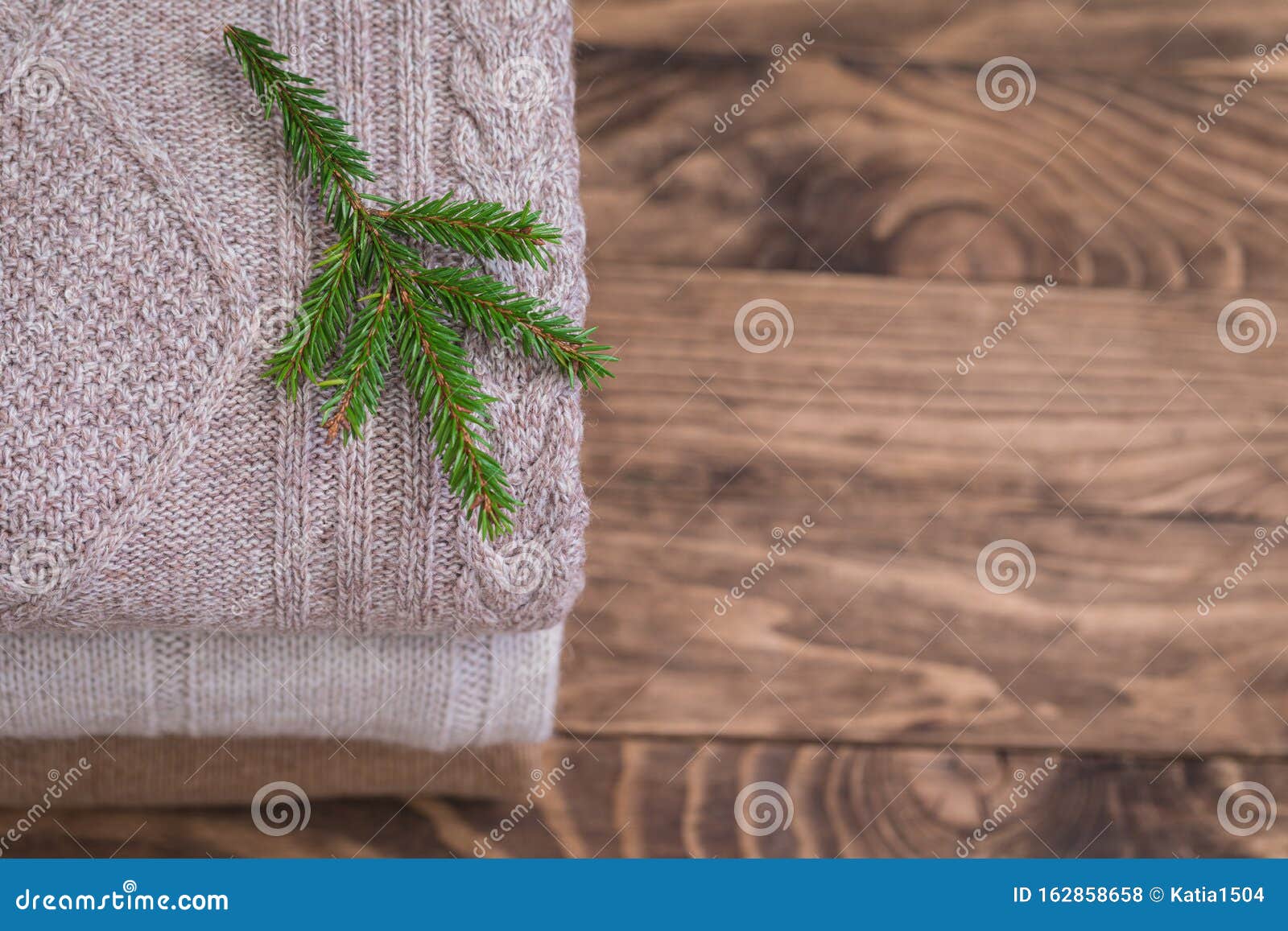 Stack of Three Cozy Knitted Sweaters on a Wooden Table. Retro Style ...