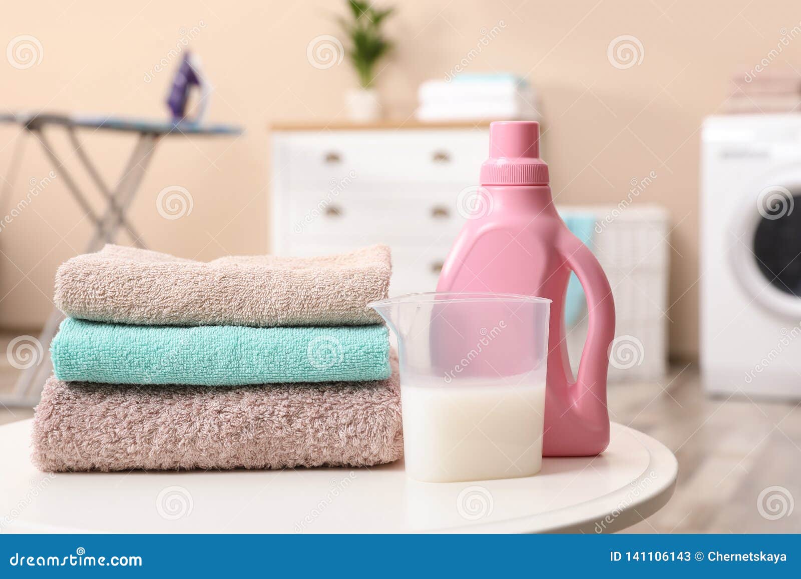 Stack of Towels and Detergent on Table Stock Image - Image of bath