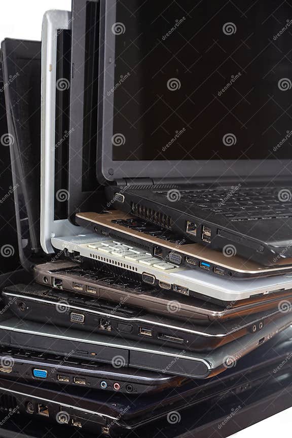 Stack of Used Laptops in Different Colors and Models. T Stock Image