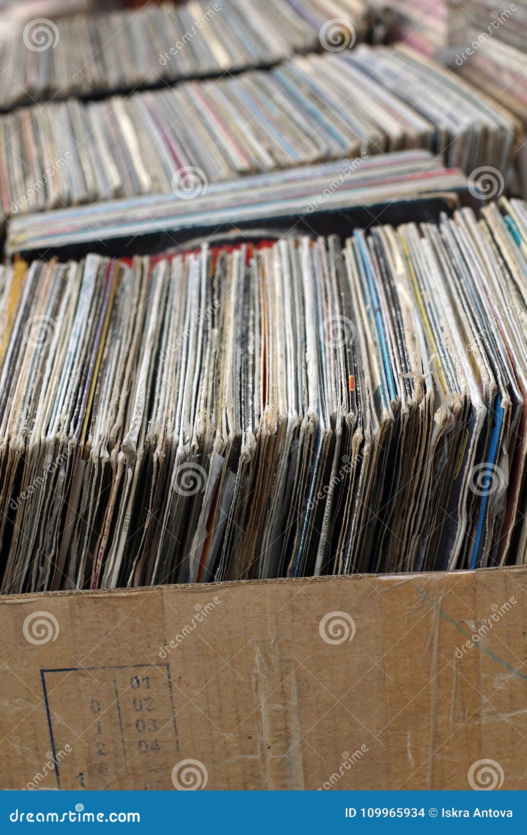 Stack of Used Vinyl Records in Covers Put on Sale Photo of collection, records: 109965934